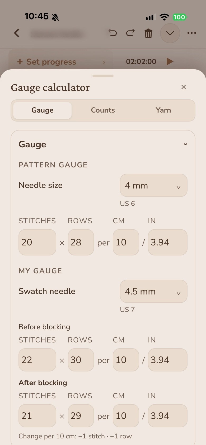 The gauge calculator open over a pattern, with the pattern gauge, the swatch needle and the gauge measured before and after blocking.