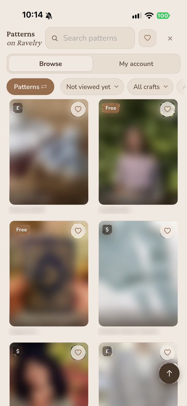Ravelry's pattern browser inside the app, a grid of pattern covers with free and paid badges, their photos deliberately blurred.